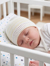 Хлопковая шапочка для новорожденных с завязками фото 2 &mdash; MamaEmma.ru